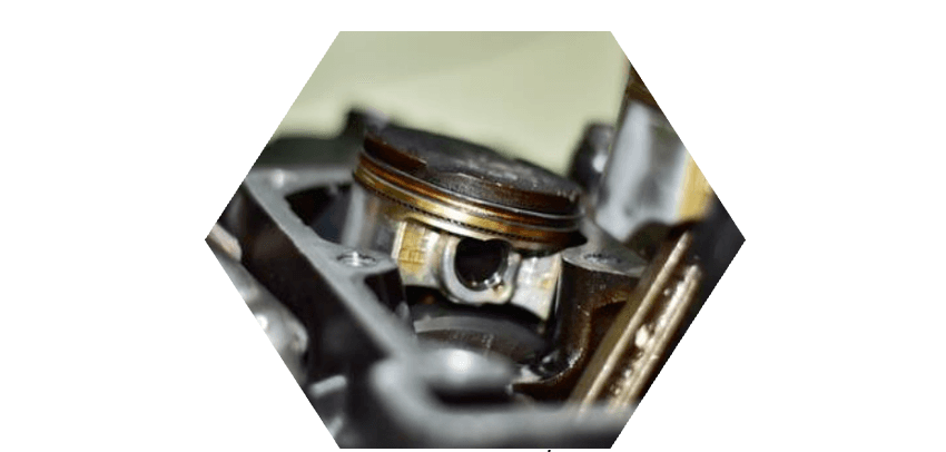 Close-up of an engine piston within the cylinder block, where G® Lubricant reduces boundary-layer friction.